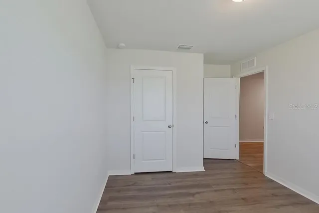 a view of room with hardwood floor