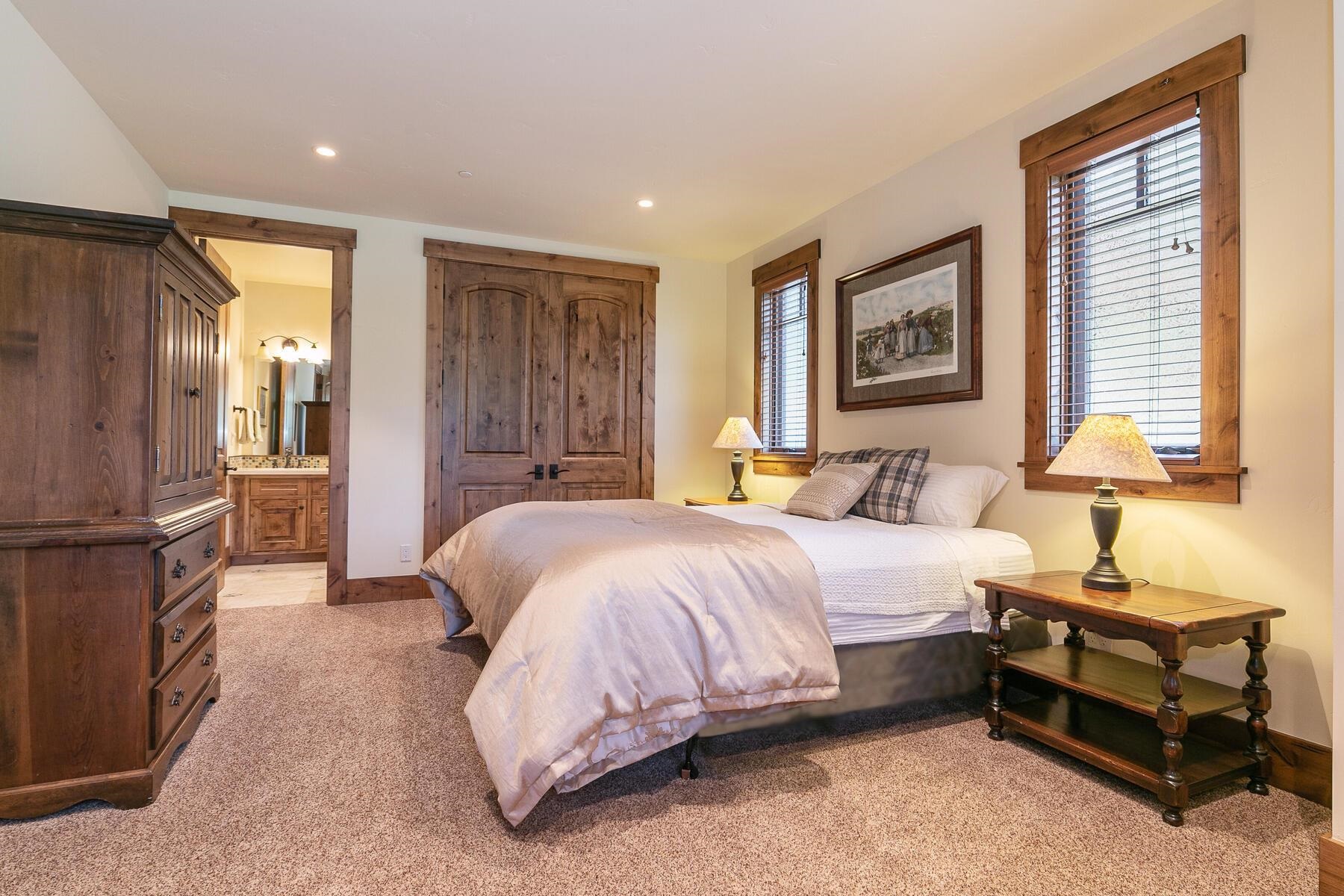 2105 Eagle Feather Truckee, CA 96161 - Photo 20 of 21 a spacious bedroom with a bed and a refrigerator