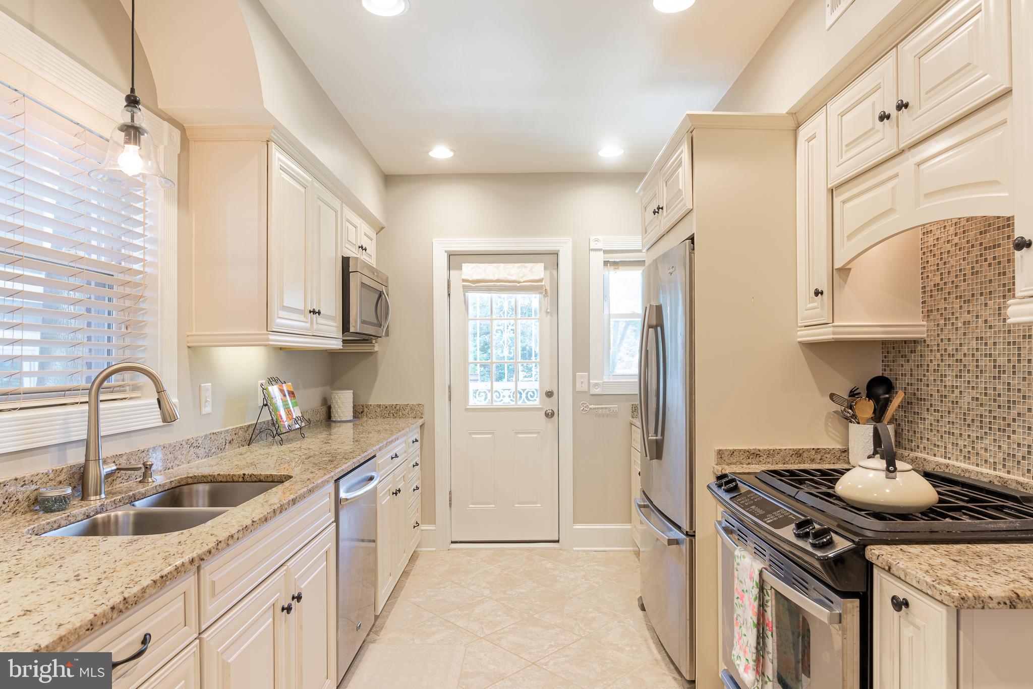 5925 16th Street Northwest Washington, DC 20011 - Photo 10 of 29 Pass-thru galley kitchen with abundant storage