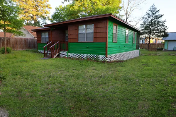 a view of a backyard of the house