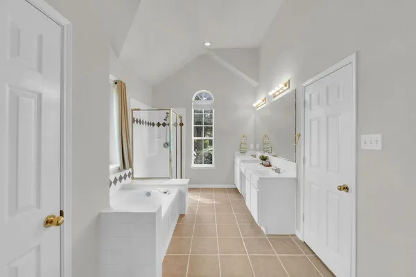 a bathroom with a bathtub and a shower