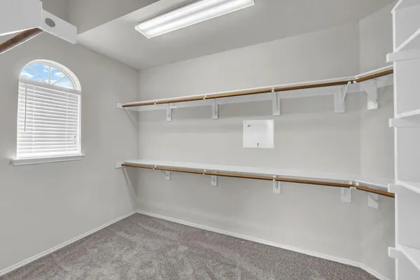 a view of an empty walk in closet