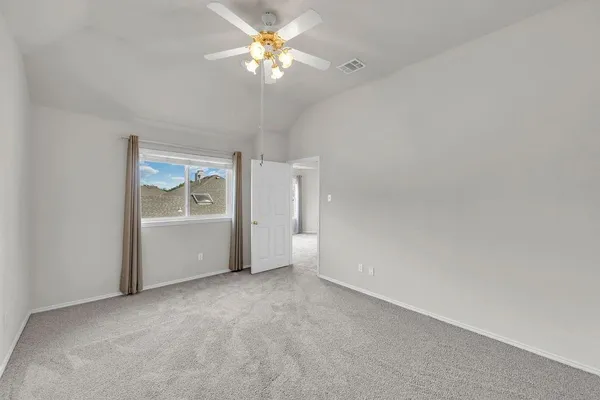 an empty room with a view of a livingroom