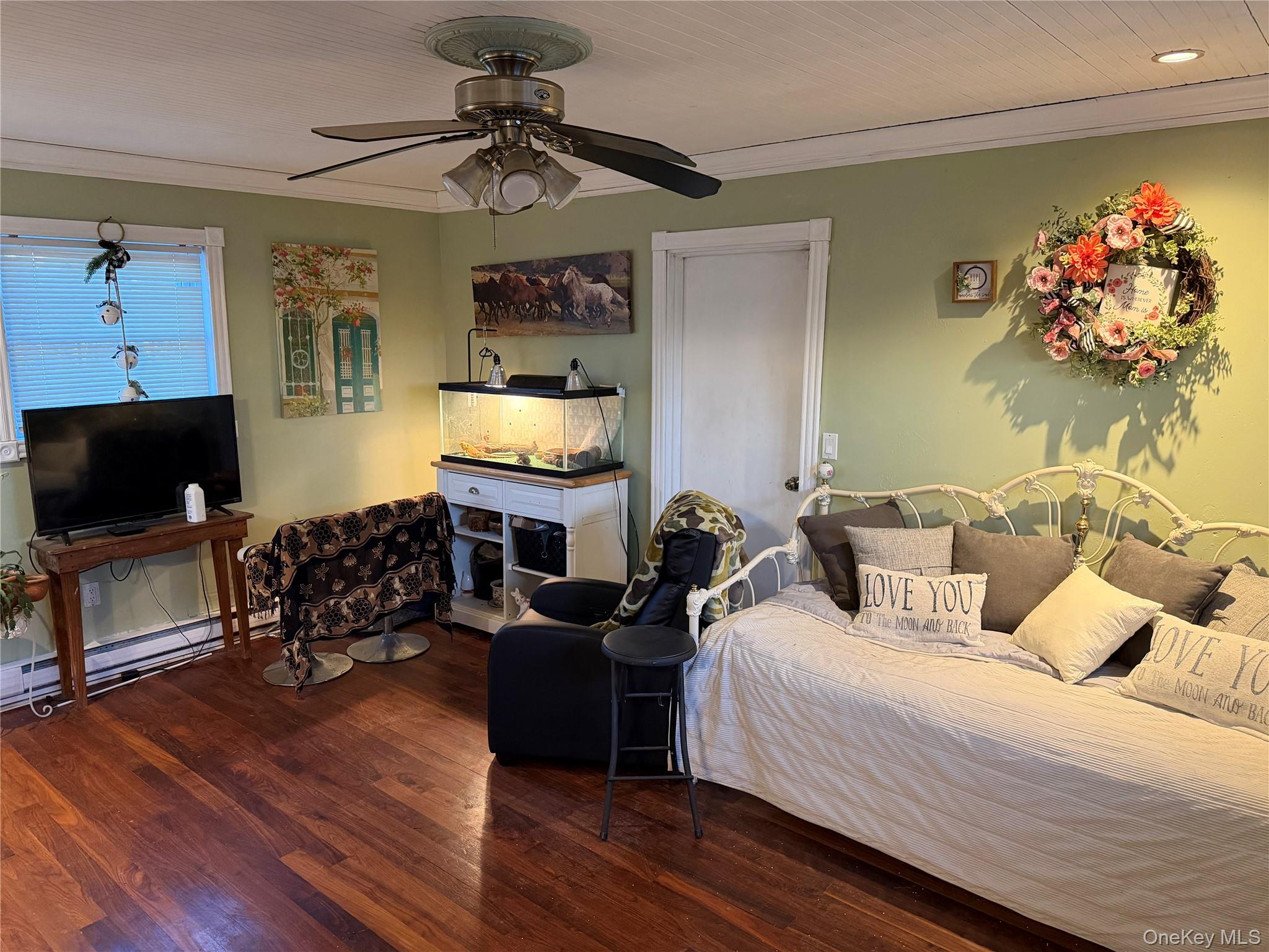 11 Bittermint Street Islip, NY 11751 - Photo 12 of 12 a bedroom with furniture and a flat screen tv