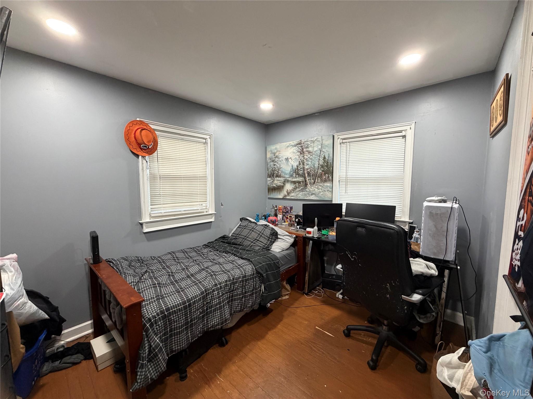 11 Bittermint Street Islip, NY 11751 - Photo 5 of 12 a bedroom with a bed and wooden floor