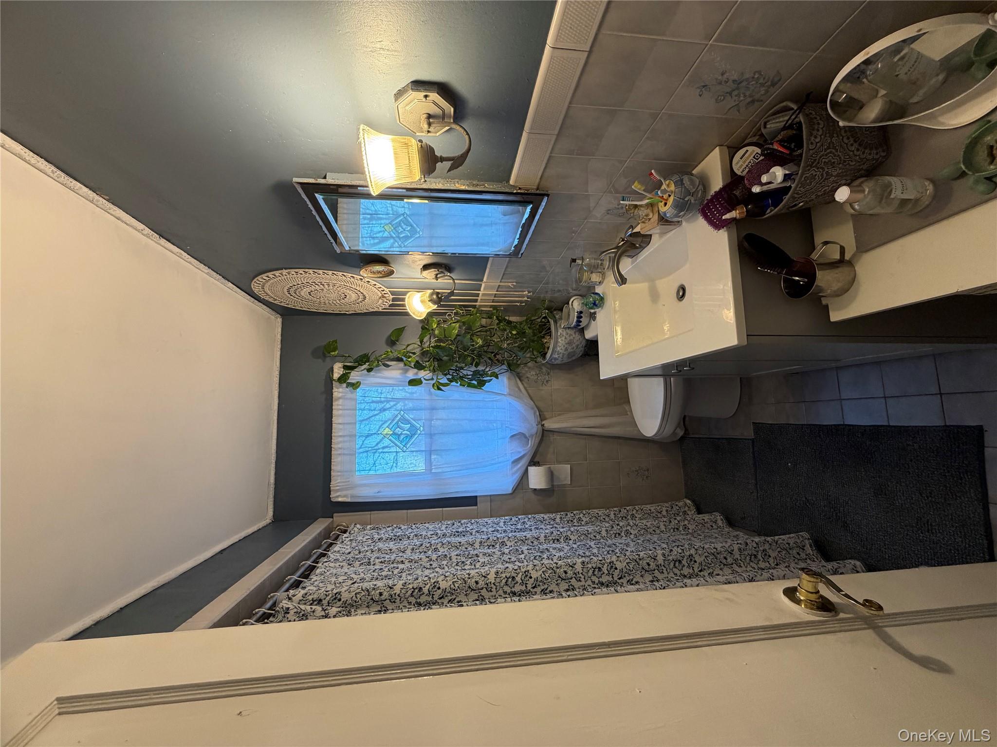 11 Bittermint Street Islip, NY 11751 - Photo 6 of 12 a bathroom with a sink mirror and vanity