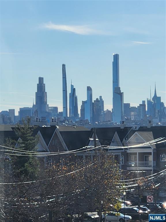 840 River Road, Unit 407 Edgewater, NJ 07020 - Photo 1 of 14 a view of a water with tall building