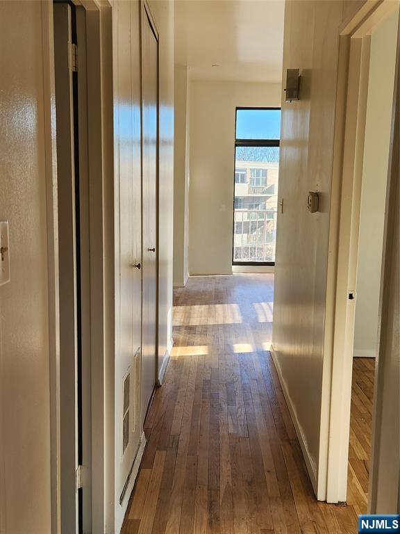 840 River Road, Unit 407 Edgewater, NJ 07020 - Photo 11 of 14 a view of gallery with wooden floor