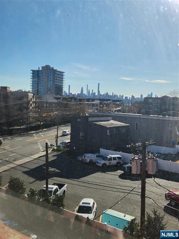 840 River Road, Unit 407 Edgewater, NJ 07020 - Photo 2 of 14 a view of a terrace with chairs