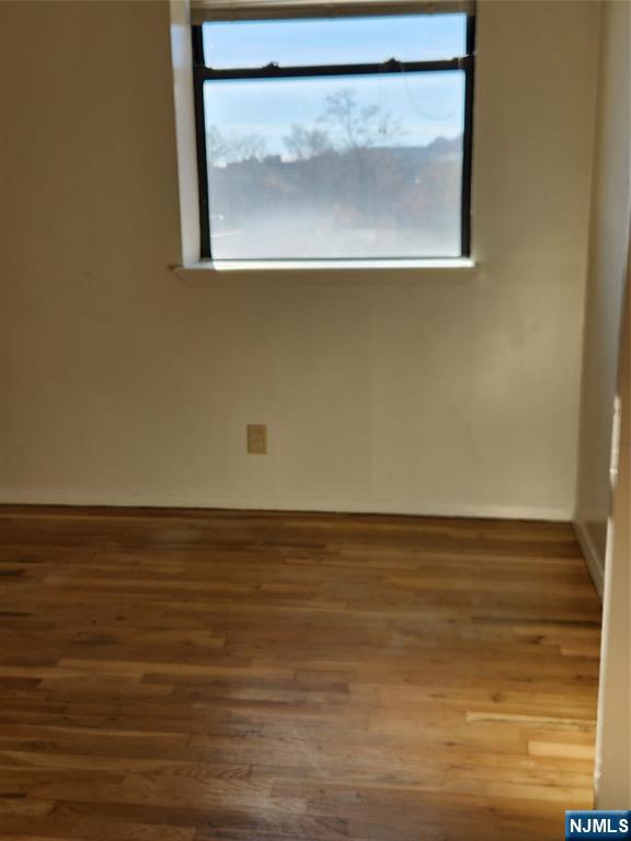 840 River Road, Unit 407 Edgewater, NJ 07020 - Photo 5 of 14 a view of room with wooden floor