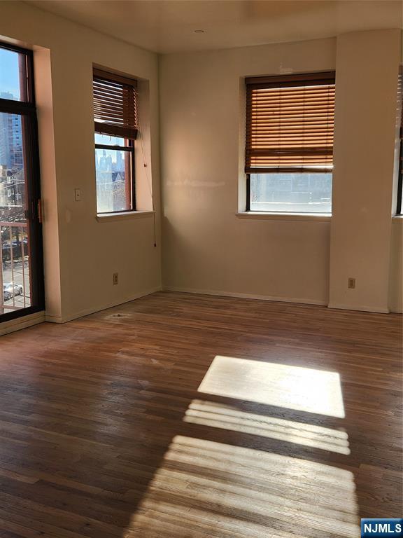 840 River Road, Unit 407 Edgewater, NJ 07020 - Photo 8 of 14 a view of entryway and hall with wooden floor