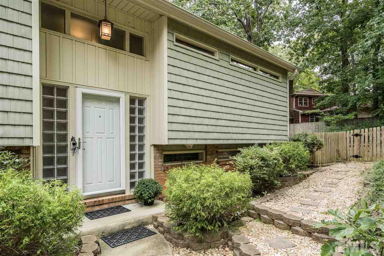 6704 Winding Trail Raleigh, NC 27612 - Photo 2 of 30 a front view of a house with a yard