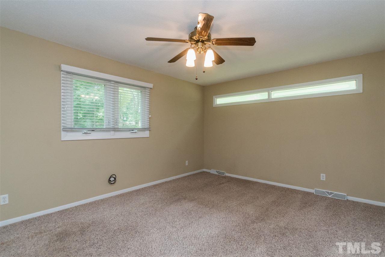 6704 Winding Trail Raleigh, NC 27612 - Photo 12 of 30 a view of an empty room with a window