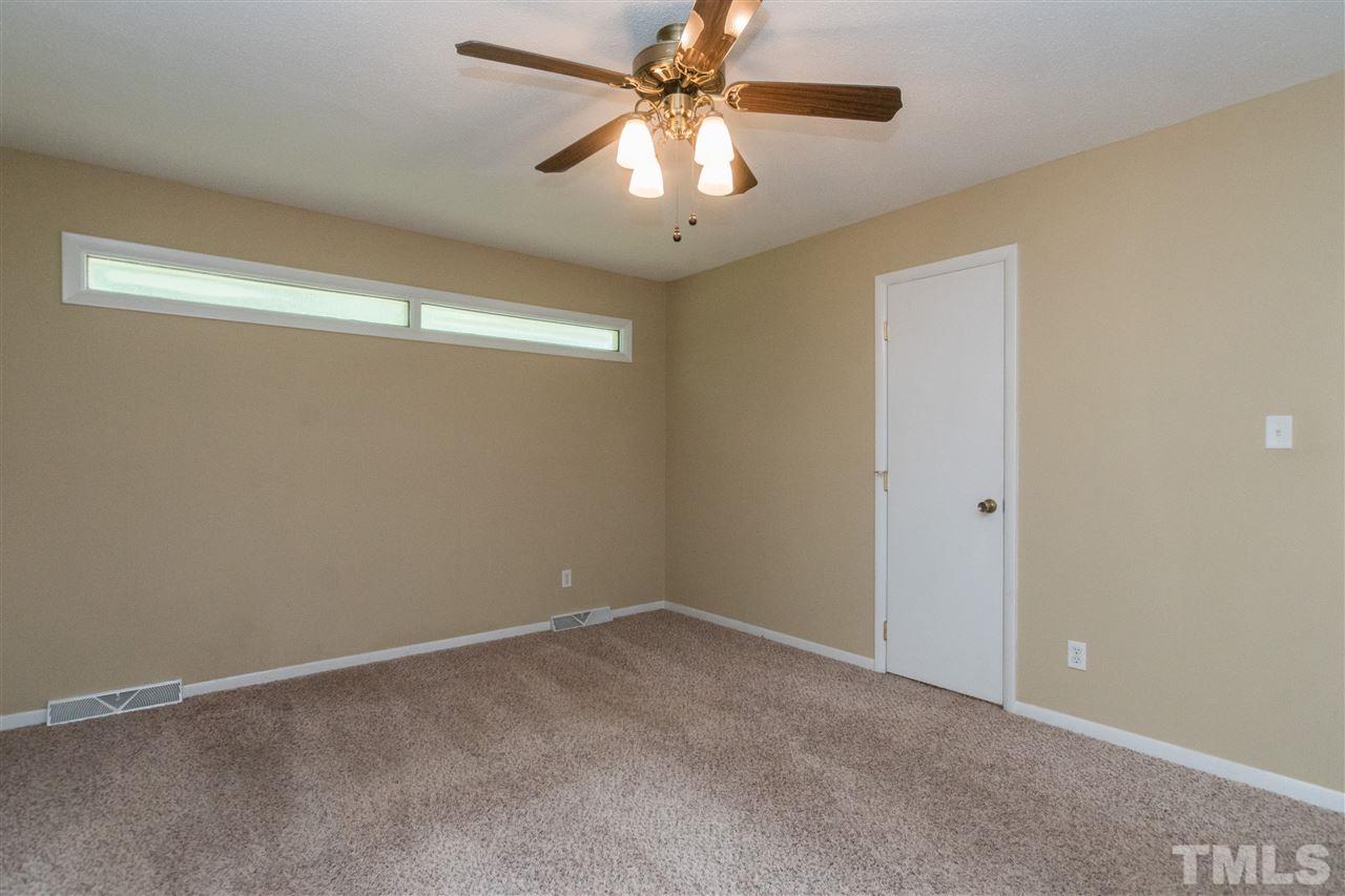 6704 Winding Trail Raleigh, NC 27612 - Photo 13 of 30 a view of an empty room