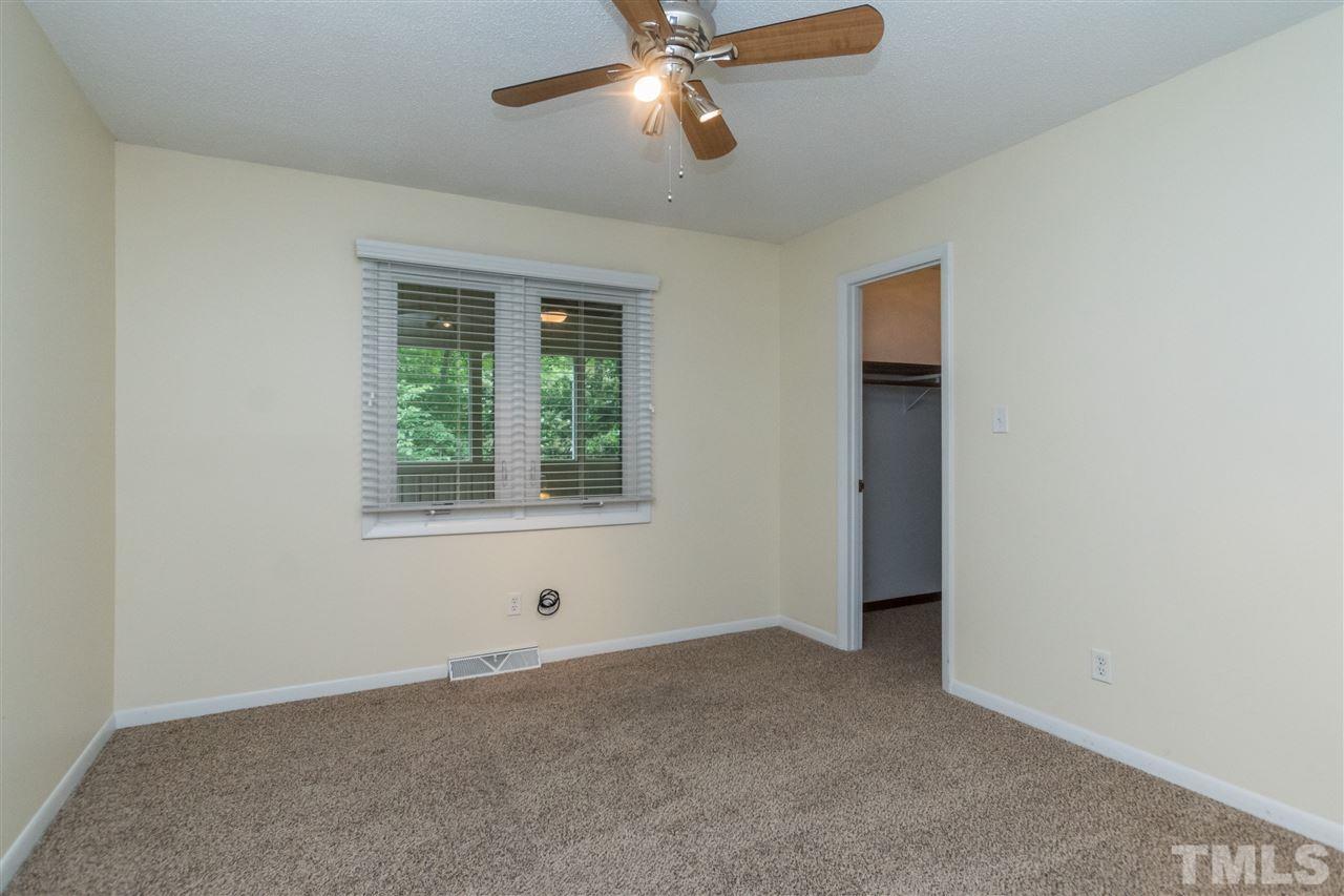 6704 Winding Trail Raleigh, NC 27612 - Photo 15 of 30 an empty room with a window and a fan