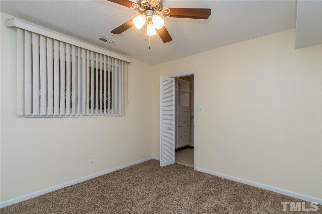 6704 Winding Trail Raleigh, NC 27612 - Photo 16 of 30 an empty room with windows and fan