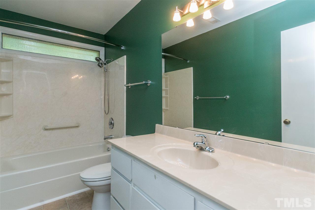 6704 Winding Trail Raleigh, NC 27612 - Photo 18 of 30 a bathroom with a sink toilet and shower