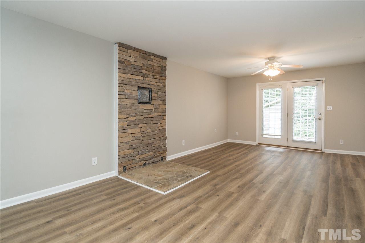 6704 Winding Trail Raleigh, NC 27612 - Photo 21 of 30 wooden floor in an empty room with a window