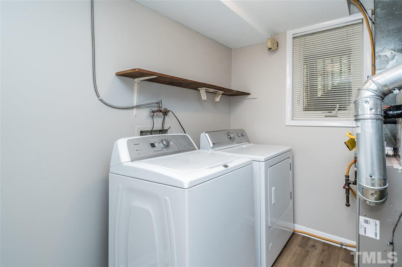 6704 Winding Trail Raleigh, NC 27612 - Photo 24 of 30 a utility room with dryer and washer