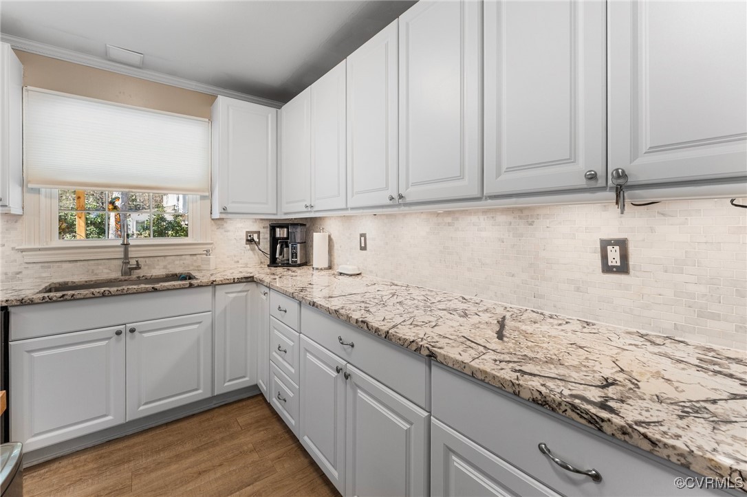 200 St Georges Boulevard Williamsburg, VA 23185 - Photo 12 of 49 Kitchen with a sink, light stone counters, wood fi