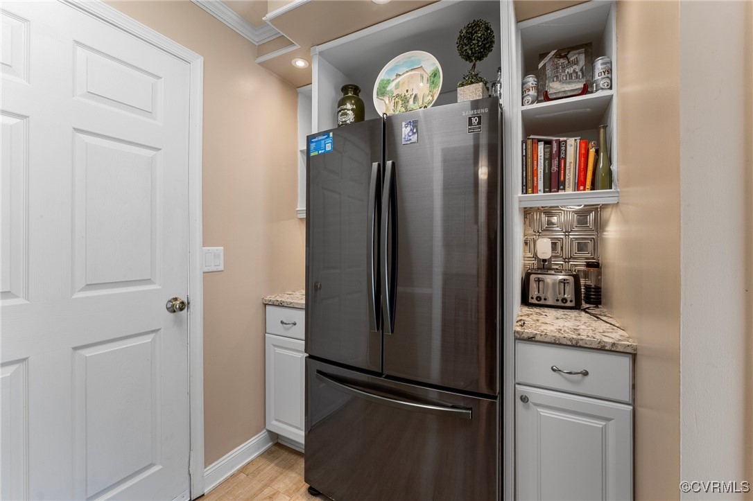 200 St Georges Boulevard Williamsburg, VA 23185 - Photo 16 of 49 Kitchen with light stone counters, baseboards, lig