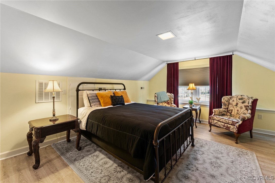 200 St Georges Boulevard Williamsburg, VA 23185 - Photo 18 of 49 Bedroom with vaulted ceiling, wood finished floors