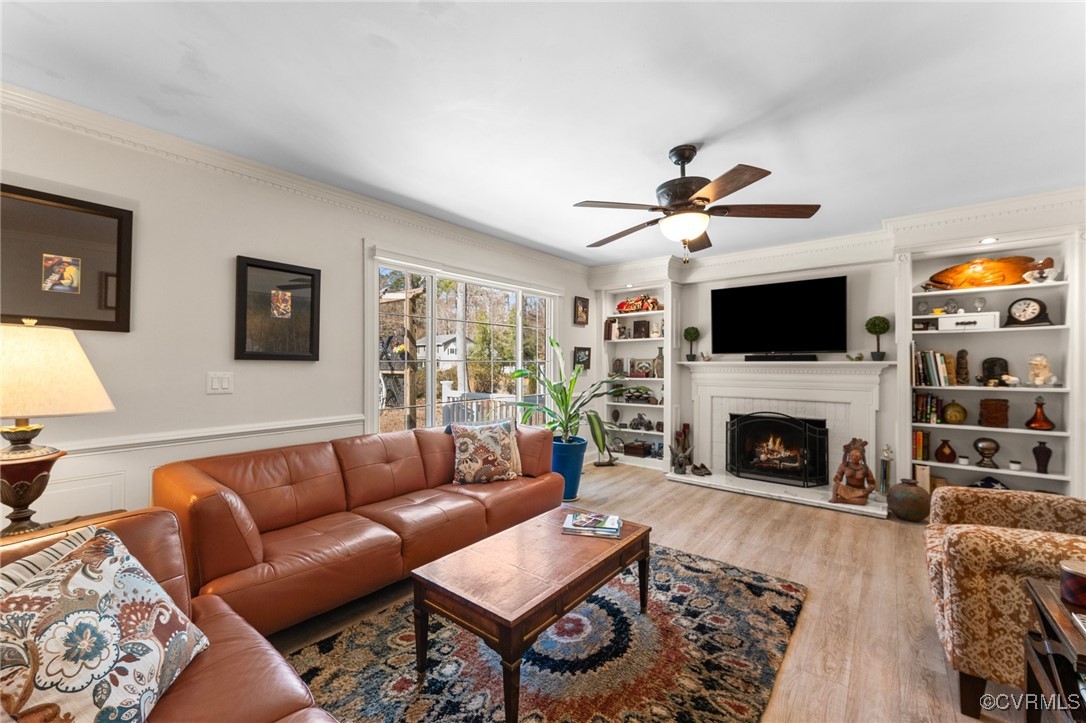 200 St Georges Boulevard Williamsburg, VA 23185 - Photo 2 of 49 Living room featuring a wainscoted wall, built in
