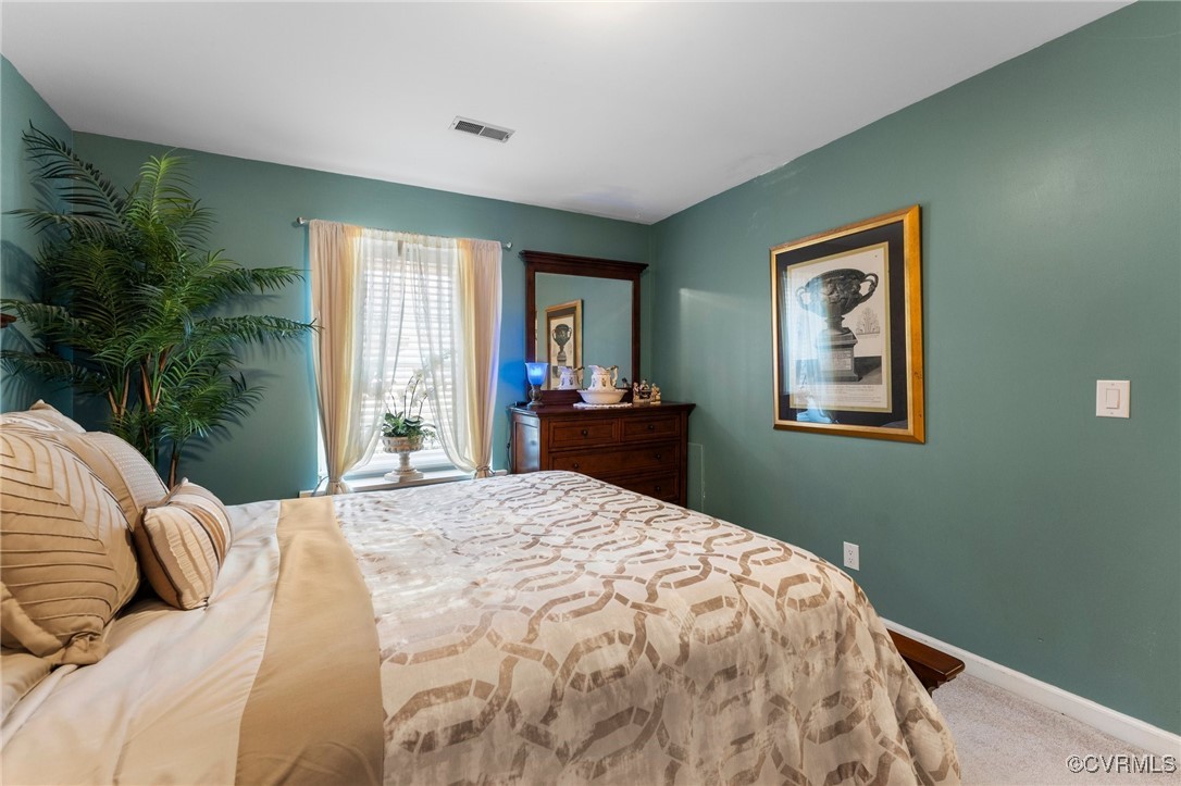 200 St Georges Boulevard Williamsburg, VA 23185 - Photo 28 of 49 Bedroom with baseboards, visible vents, and carpet