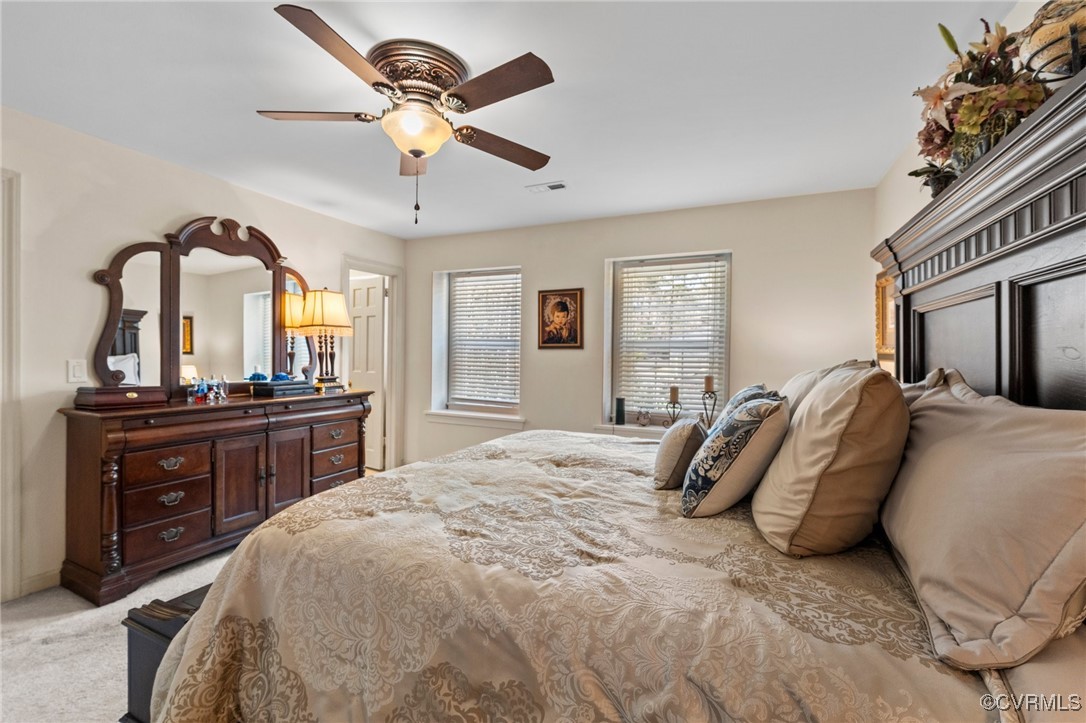 200 St Georges Boulevard Williamsburg, VA 23185 - Photo 30 of 49 Bedroom featuring light carpet, visible vents, and