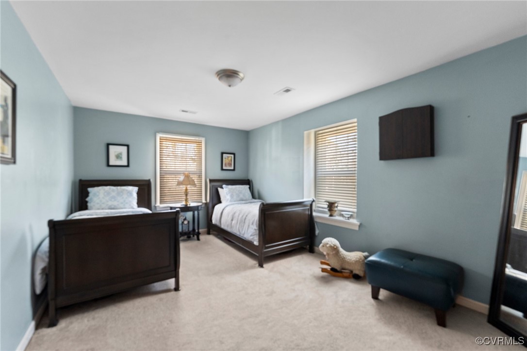 200 St Georges Boulevard Williamsburg, VA 23185 - Photo 34 of 49 Bedroom featuring visible vents, multiple windows,