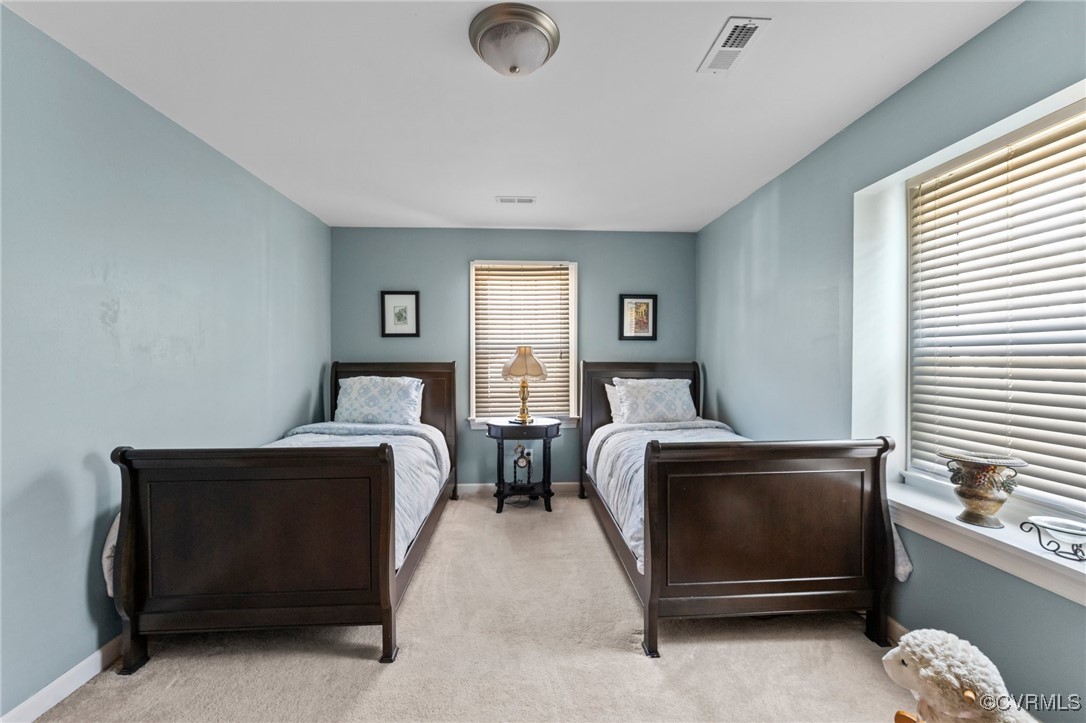 200 St Georges Boulevard Williamsburg, VA 23185 - Photo 35 of 49 Bedroom featuring baseboards, visible vents, and l