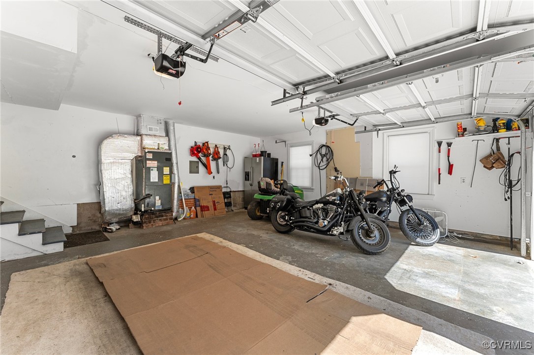 200 St Georges Boulevard Williamsburg, VA 23185 - Photo 39 of 49 Garage featuring heating unit, stainless steel fri