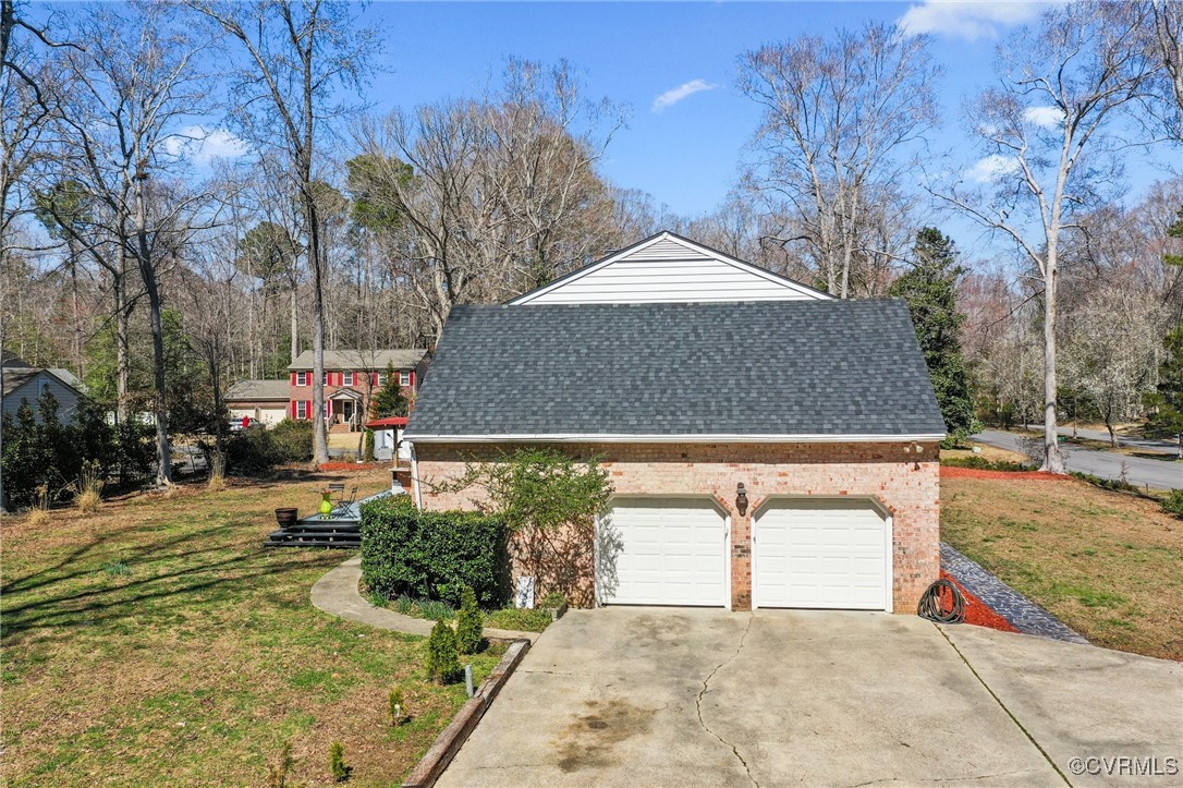 200 St Georges Boulevard Williamsburg, VA 23185 - Photo 41 of 49 View of side of property featuring driveway, roof