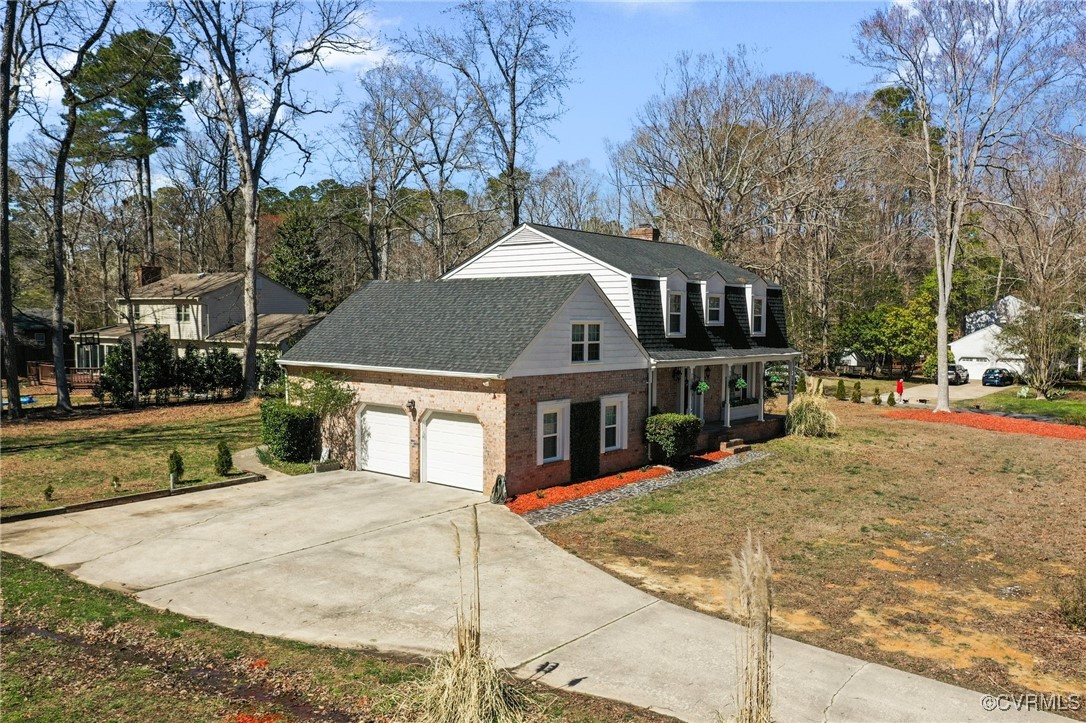 200 St Georges Boulevard Williamsburg, VA 23185 - Photo 42 of 49 View of front facade with brick siding, a shingled