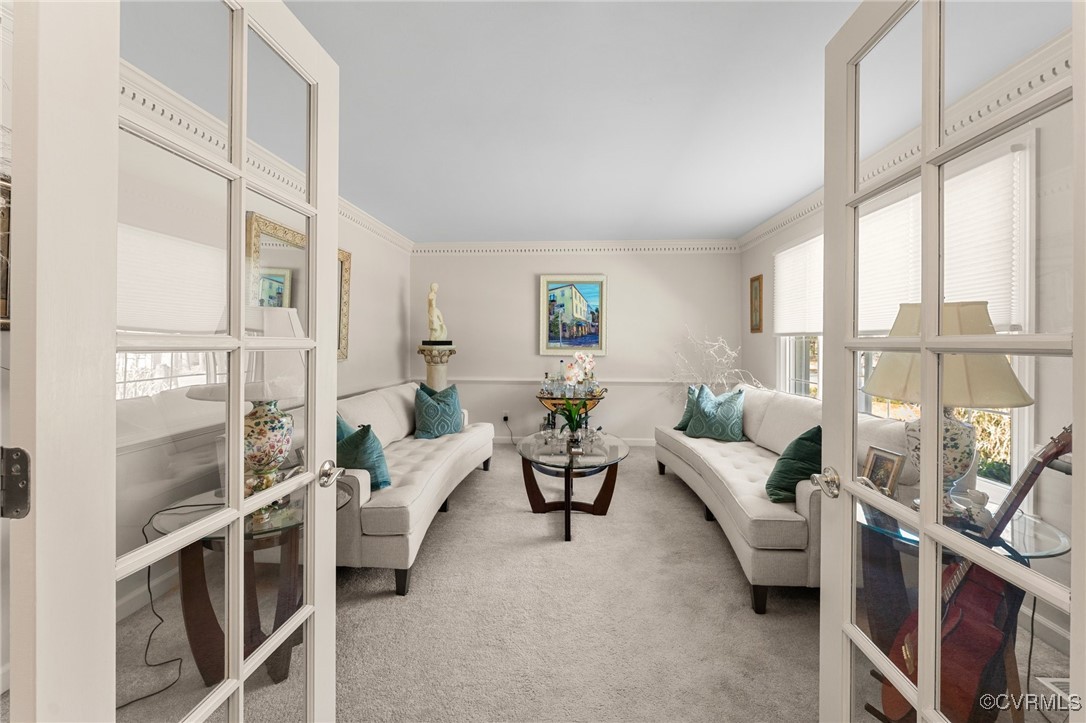 200 St Georges Boulevard Williamsburg, VA 23185 - Photo 9 of 49 Carpeted living area with crown molding, french do