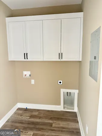 a view of room with wooden floor