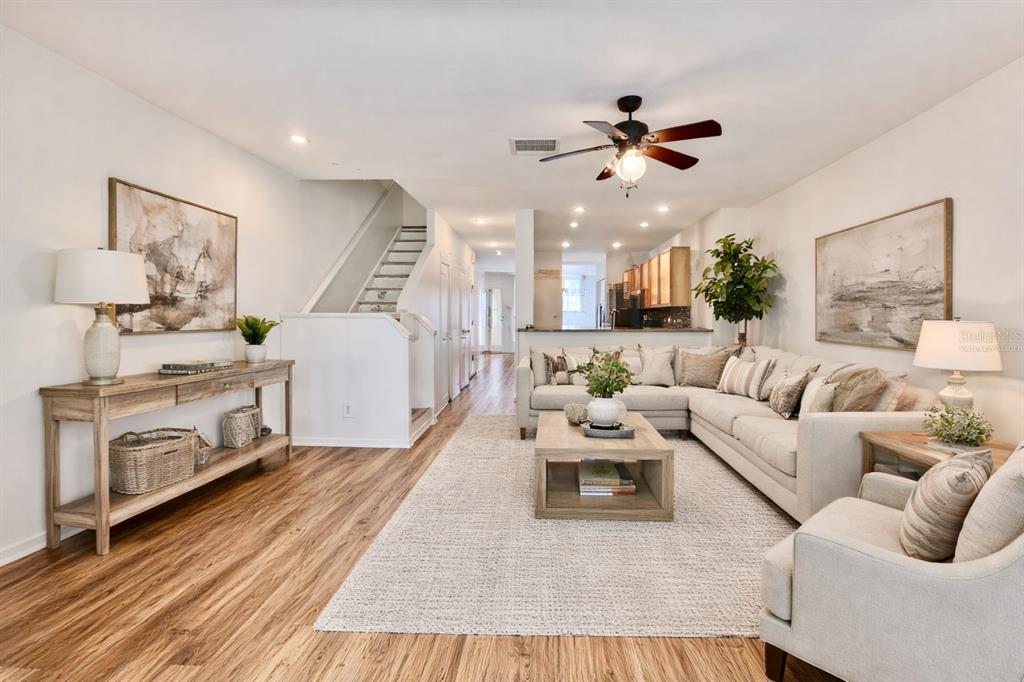 15609 Stable Run Drive Spring Hill, FL 34610 - Photo 12 of 37 a living room with furniture and a fireplace