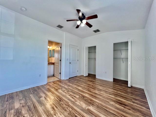 15609 Stable Run Drive Spring Hill, FL 34610 - Photo 27 of 37 a view of empty room with wooden floor