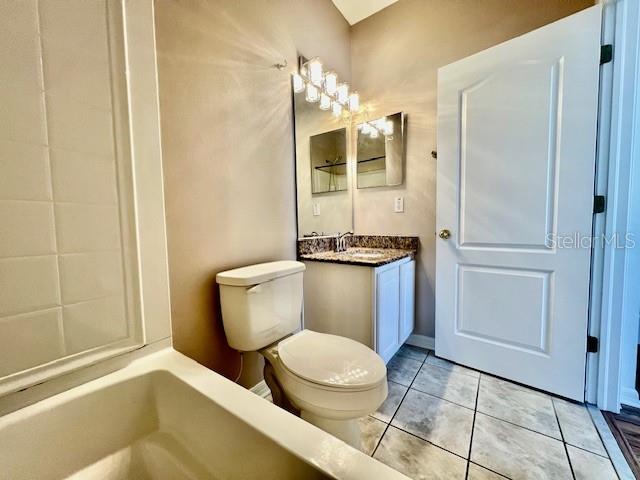 15609 Stable Run Drive Spring Hill, FL 34610 - Photo 29 of 37 a bathroom with a toilet a sink and shower