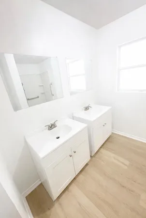 a view of bathroom with dual sinks