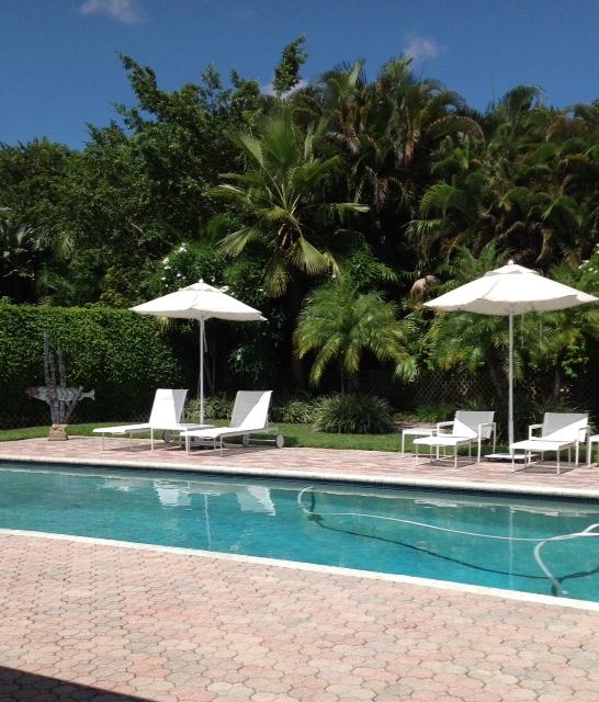 5758 Northwest 24th Terrace Boca Raton, FL 33496 - Photo 2 of 35 a house view with a garden space