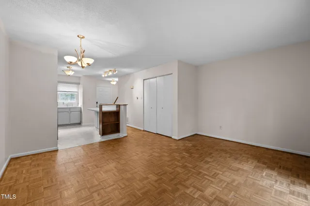 a kitchen with cabinets appliances and a window