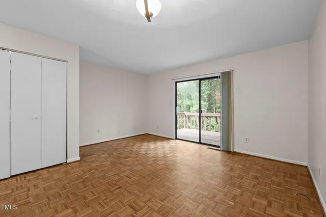 a kitchen with cabinets appliances and a window