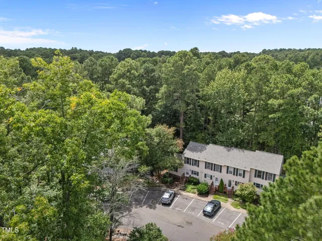 an aerial view of a house with outdoor space