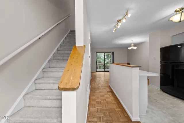 an aerial view of a houses with houses and yard