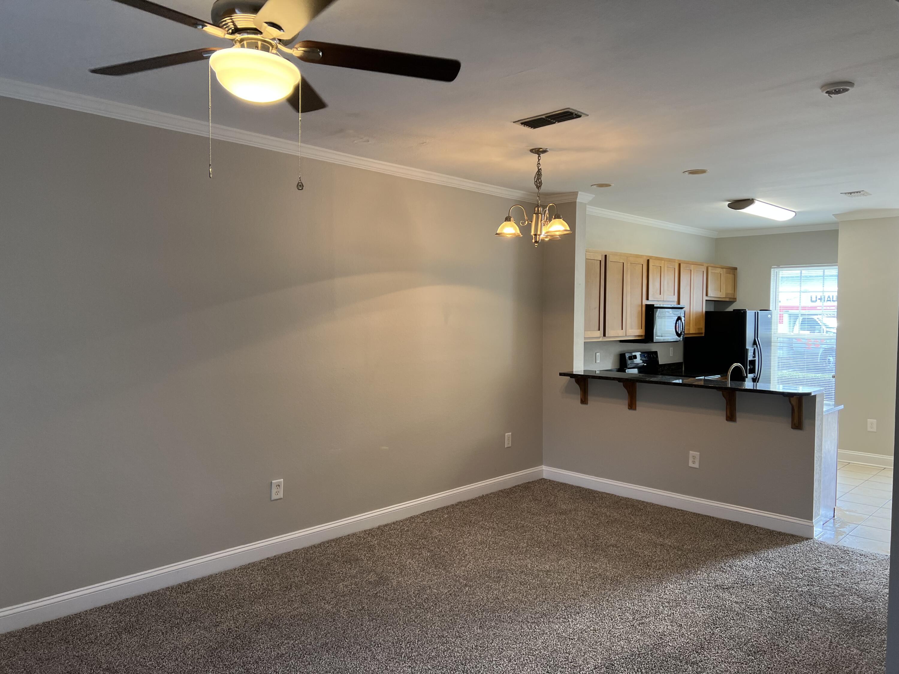 31 North Sand Palm Road Freeport, FL 32439 - Photo 11 of 23 a view of a room with a ceiling fan and a window
