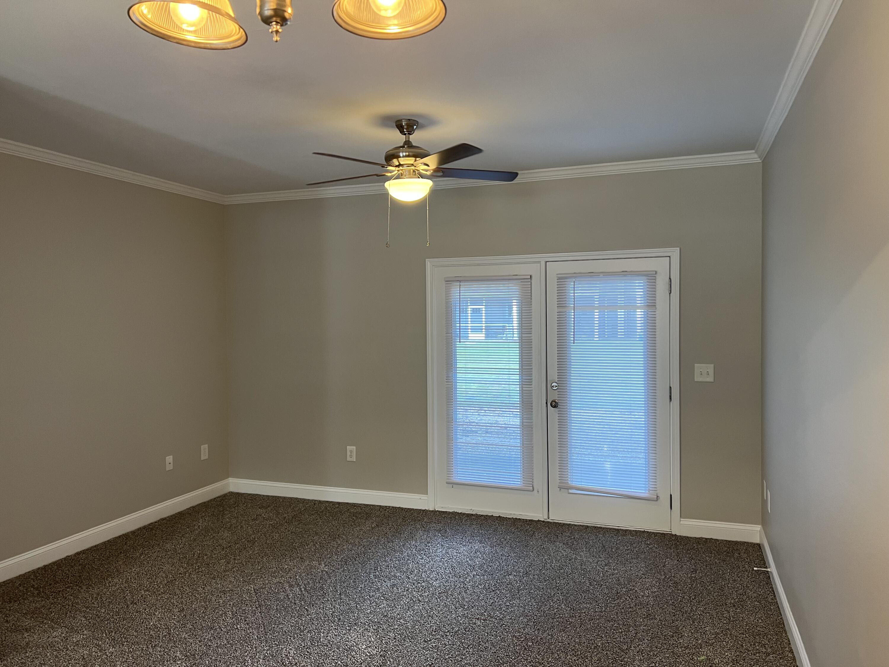31 North Sand Palm Road Freeport, FL 32439 - Photo 8 of 23 an empty room with windows and fan