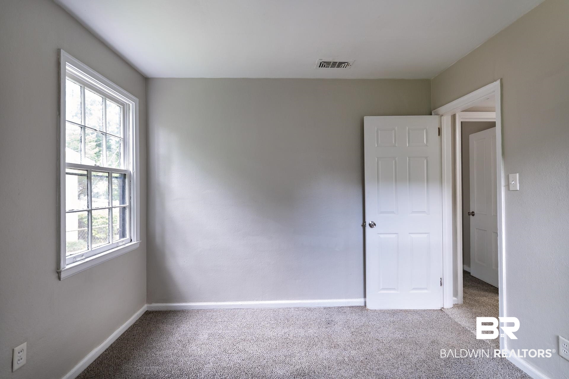 1869 Mott Drive West Mobile, AL 36617 - Photo 21 of 34 Carpeted empty room featuring baseboards and visible vents