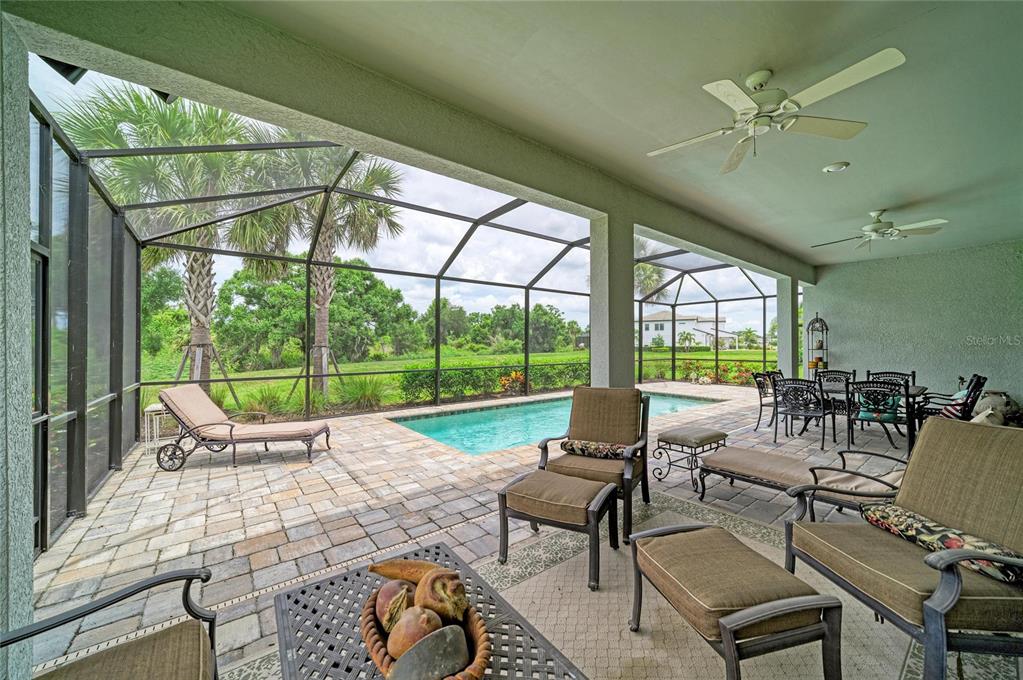 16341 Hidden Oak Loop Lakewood Ranch, FL 34211 - Photo 58 of 76 a building outdoor space with patio furniture and garden
