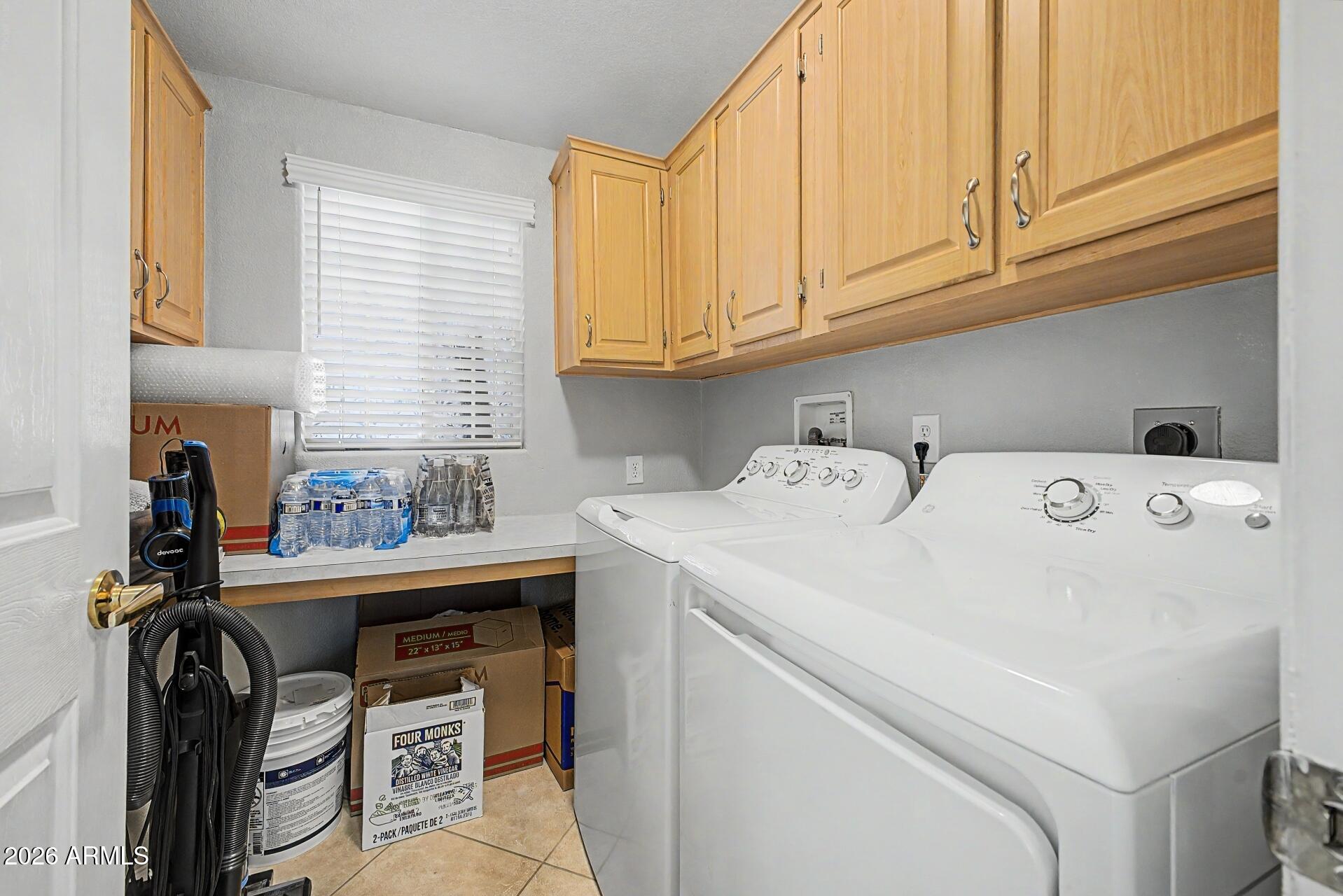 2550 South Ellsworth Road, Unit 46 Mesa, AZ 85209 - Photo 26 of 46 a utility room with dryer and washer